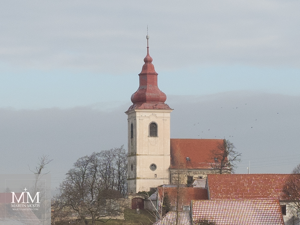 Baroque church, flock of birds. Photograph created with Olympus 12 - 40 mm 2.8 Pro lens.